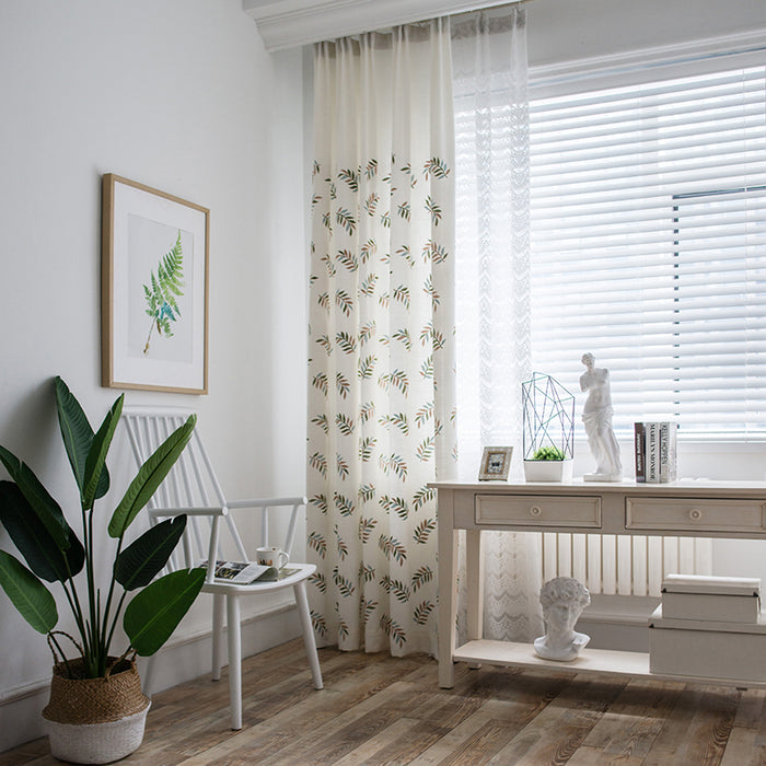 Draped view of the Melodieux rod pocket embroidered curtain